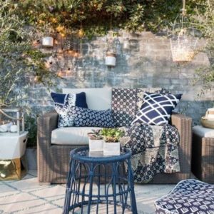Colourful cushions and throws on outdoor furniture