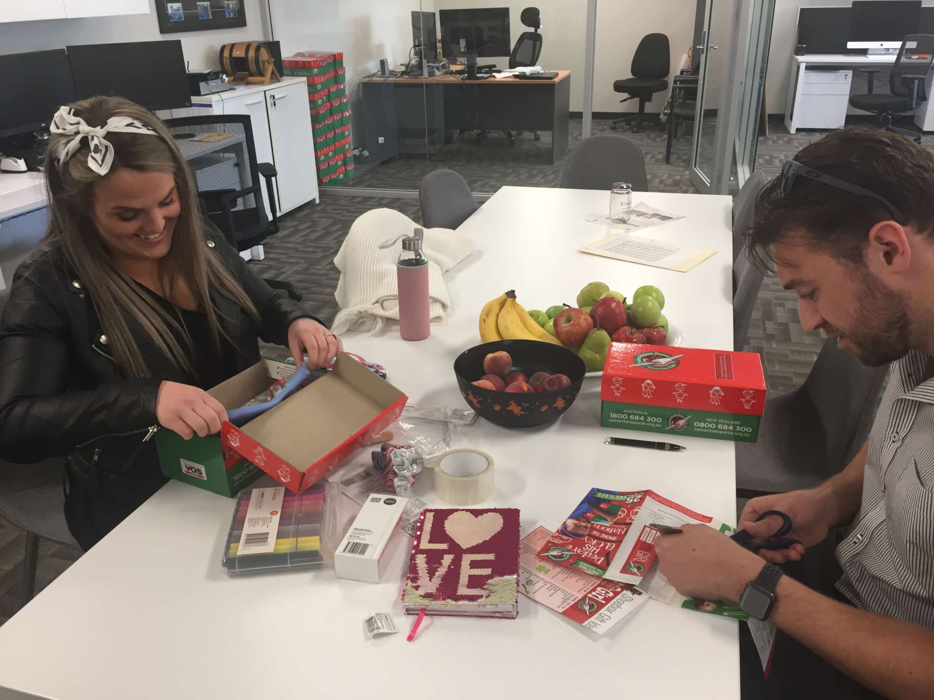 AOL gets into Christmas spirit - Acting Branding Manager Mary Moloney and SA General Manager David Wegener fill their shoeboxes, Australian Outdoor Living.