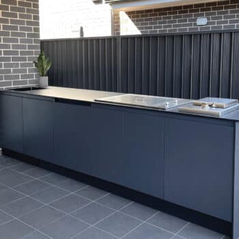 Outdoor Kitchen With Charcoal Cabinetry, Dark Cement Benchtop, Wok Burner and Flat Cooktop